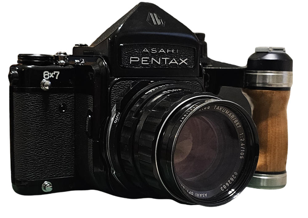 Asahi Pentax 6x7 medium format film camera with wooden hand grip — the camera behind every session